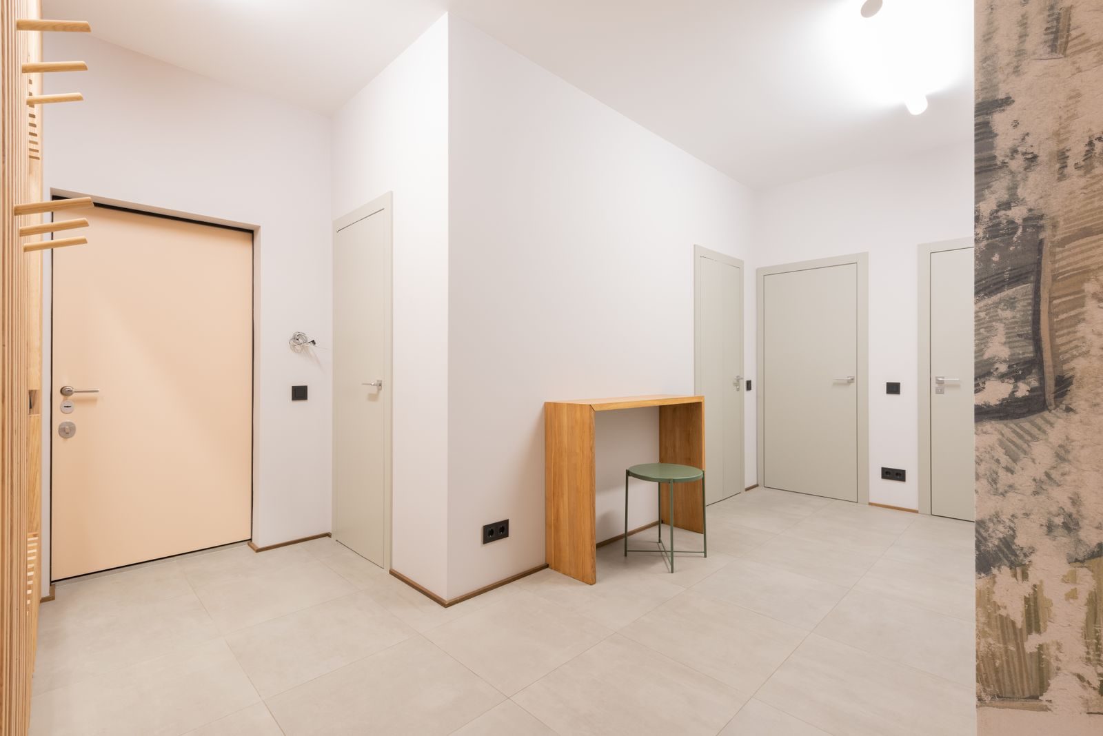 Bright minimalist hallway in a modern apartment featuring clean lines and contemporary style.
